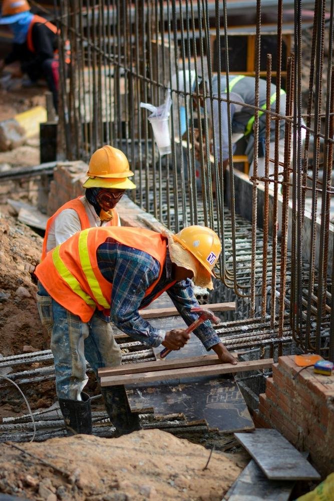 Construction workers in hard hats on a job site
